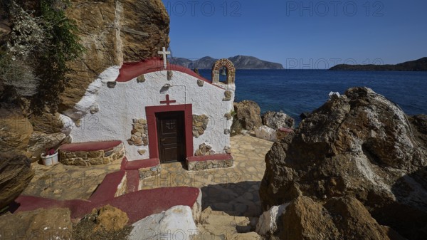 Legend, Crab, Mussel fisherman, Stony terrace in front of a chapel with red roof by the sea, surrounded by rocks, in Mediterranean scenery, Chapel, Little church, Monastery of Agia Kavouradena, Xirokambos, Leros, Dodecanese, Greek Islands, Greece