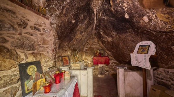 Legend, crab, mussel fisherman, interior of a rock chapel with religious icons and candles, chapel, small church, Agia Kavouradena Monastery, Xirokambos, Leros, Dodecanese, Greek Islands, Greece