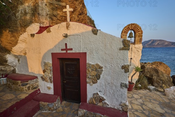 Legend, Crab, Mussel fisherman, Small coastal chapel with wooden facade facing the sea and embedded in rocks, Chapel, Little church, Monastery of Agia Kavouradena, Xirokambos, Leros, Dodecanese, Greek Islands, Greece