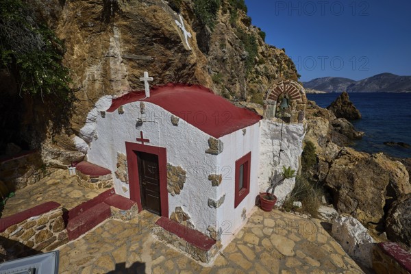 Legend, crab, shell fisherman, chapel on the rocky coast with red roof and sea view, under a clear sky, Mediterranean natural scenery, chapel, small church, Agia Kavouradena monastery, Xirokambos, Leros, Dodecanese, Greek Islands, Greece