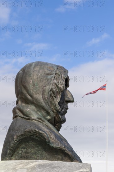 Roald Amundsen in front of the Norwegian flag, Ny-Alesund, Spitsbergen, Svalbard