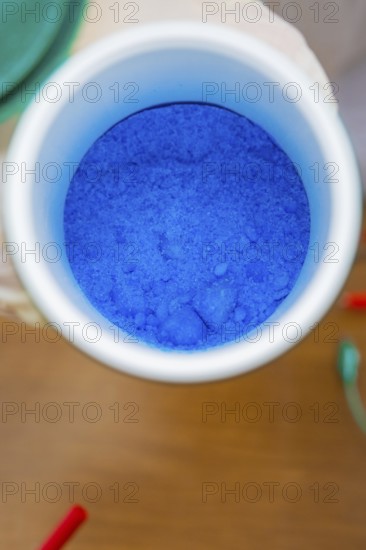 Close-up of a container with blue powder in a laboratory, Battery Research, Nagold, Germany