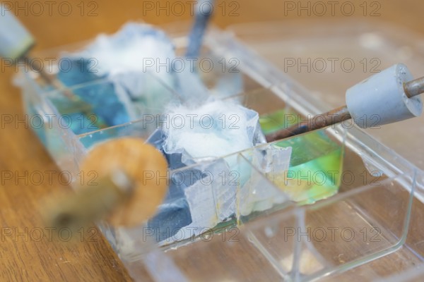 Close-up of electrodes and wires in a bowl of liquid, Battery Research, Nagold, Germany