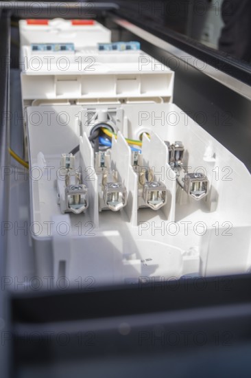 Detailed image of connections in an electrical device, assembly of a charging station for electric cars, Calw, Germany