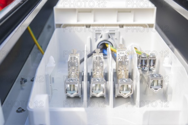 Interior view of a fuse box with various connections and cables, installation of a charging station for electric cars, Calw, Germany