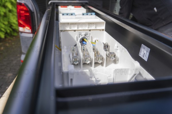 Electrical connections visible in a housing, from the side, installation of a charging station for electric cars, Calw, Germany