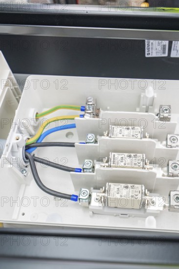 Close-up of an electrical switch box with built-in fuses and cables, installation of a charging station for electric cars, Calw, Germany
