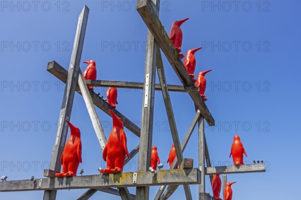 Rode Pinguins, Red Penguins, artwork by Belgian artist William Sweetlove in the harbour of Breskens along the Western Scheldt, Zeeland, Netherlands