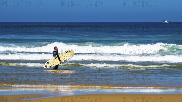 Surfer on Contis beach, Saint Julien en Born, Saint-Julien-en-Born, Landes, France
