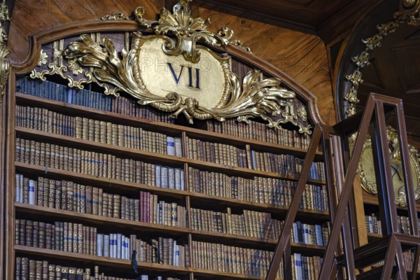 In the Baroque State Hall of the Court Library in the Austrian National Library in the Vienna Hofburg Imperial Palace, Vienna, Austria, for editorial use only