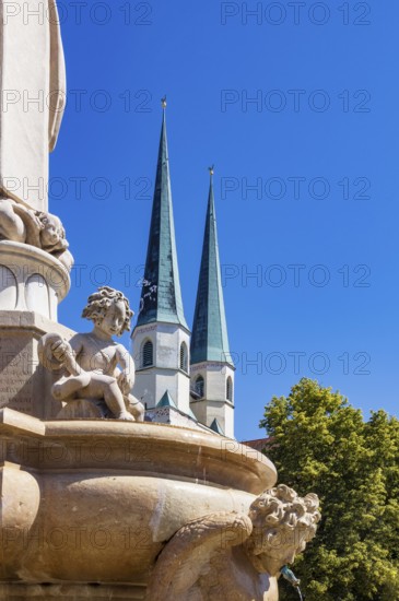 Marienbrunnen fountain on Kapellplatz with St.Philippus and Jakobus collegiate parish church, place of pilgrimage, Altötting, Upper Bavaria, Bavaria, Germany
