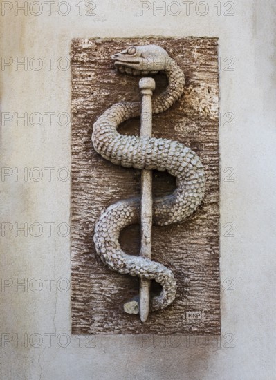 Aesculapian staff, apothecary symbol on a house wall, place of pilgrimage, Altötting, Upper Bavaria, Bavaria, Germany