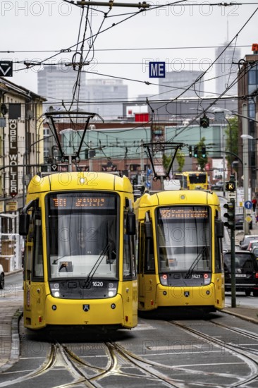 Ruhrbahn tram, on Altendorfer Straße, intersection Helenenstraße, in Essen-Altendorf, rush hour, traffic, skyline of the city centre of Essen, North Rhine-Westphalia, Germany