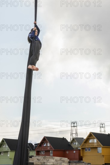 Aerial acrobatics, girls, catch for King Harald as part of the end of coal mining, Longyearbyen, Spitsbergen