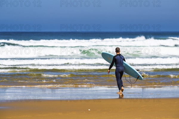 Surfer on Contis beach, Saint Julien en Born, Saint-Julien-en-Born, Landes, France