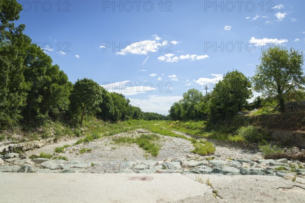 Extensive dry riverbed of the Schwarza with vegetation and surrounding nature, Neunkirchen, Lower Austria, Austria