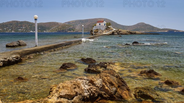 Rocky coastal landscape with lonely chapel, accessible from path, in calm waters, chapel, church, Agios Isidoros, rocky islet, Bay of Gourna, Kokkali, Leros, Dodecanese, Greek Islands, Greece