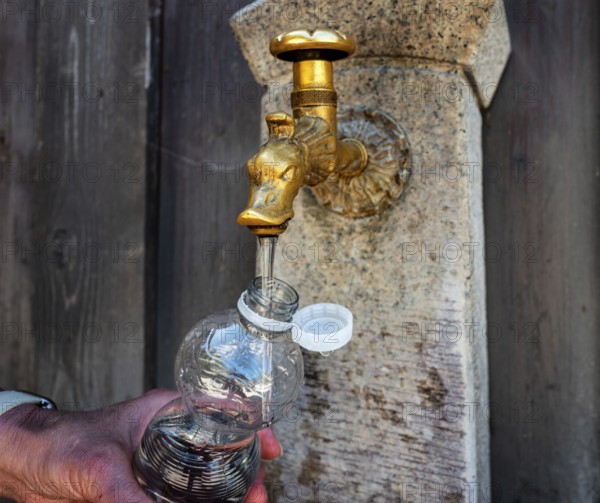 Drinking water supply at a public well, Bavaria, Germany