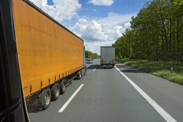 Overtaking manoeuvre by articulated lorry, lorry overtaken, A3 motorway near Nuremberg, Middle Franconia, Franconia, Bavaria, Germany