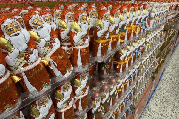 Huge large shelf with chocolate Santa Claus chocolate Santa Claus chocolate Santa Claus chocolate Santa Claus sweets from Lindt brand, international