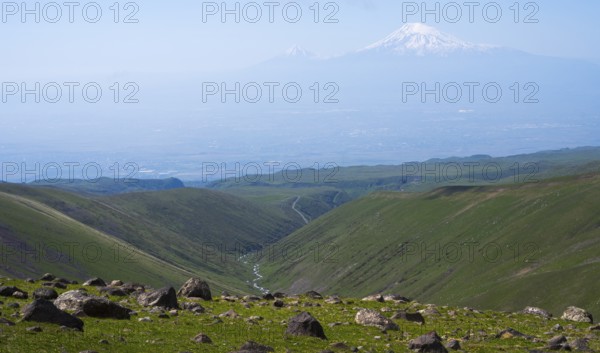 Extensive landscape with green valleys and snow-capped mountains on the horizon, view from Aragaz to Ararat, Aragats, Aragac, Alagyaz, Aragazotn, Armenia