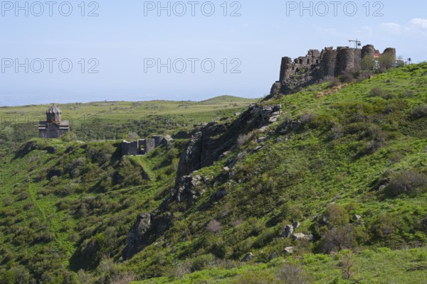 Ruins of an old fortress on a green hill in rural surroundings, Amberd Fortress and Mother of God Church, Vahramashen Surp Astvatsatsin, Amberd Church, Amberd Gorge, Aragazotn Province, Armenia