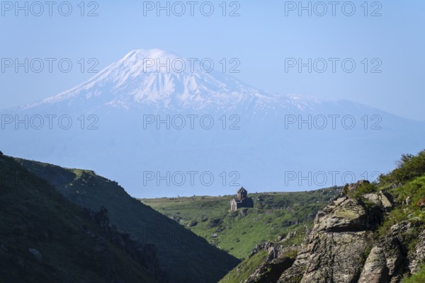 Small church in a valley dominated by snow-capped Mount Ararat under bright skies, Our Lady Church with Ararat in the background, Vahramashen Church, Vahramashen Surp Astvatsatsin, Amberd Gorge, Aragazotn Province, Armenia