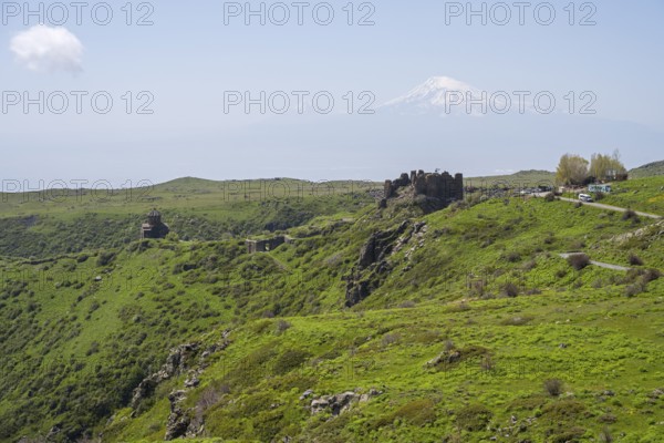 Ruins in green landscape with majestic mountain in background, Amberd Fortress and Mother of God Church with Ararat, Vahramashen Church, Vahramashen Surp Astvatsatsin, Amberd Church, Aragazotn Province, Armenia