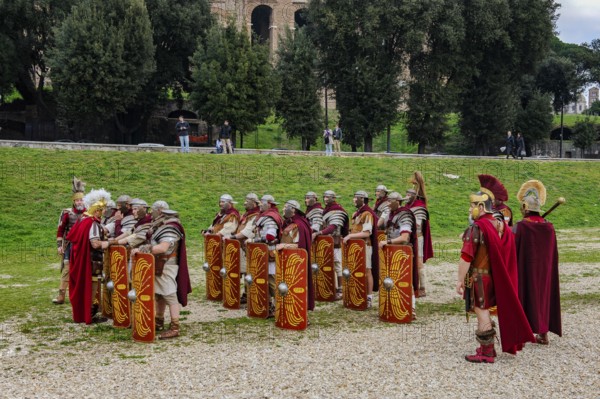 Traditional group of Roman legionaries soldiers lining up with large shield and swords next to Centurion Centurion, Circus Maximus, Rome, Italy