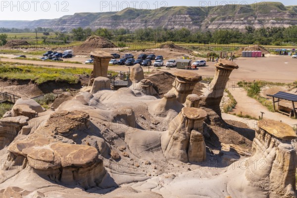 Breathtaking panorama featuring unique hoodoo rock formations in drumheller valley, highlighting the geological wonders of the canadian badlands on a sunny day