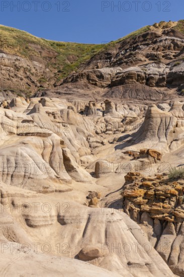 Breathtaking view of the arid landscape featuring unique hoodoo rock formations rising from the valley floor in drumheller, alberta, canada, showcasing the power of erosion and the beauty of nature