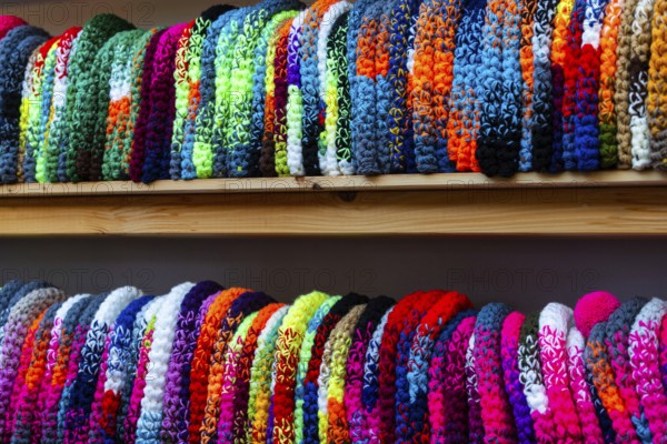 Colourful woolen hats on the shelf, Christmas market, city of Esslingen, district of Esslingen, Baden-WÃ¼rttemberg, Germany