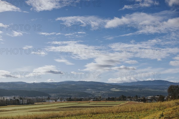Wide fields and hills under a vast sky with loose clouds, Ternitz, Lower Austria, Austria