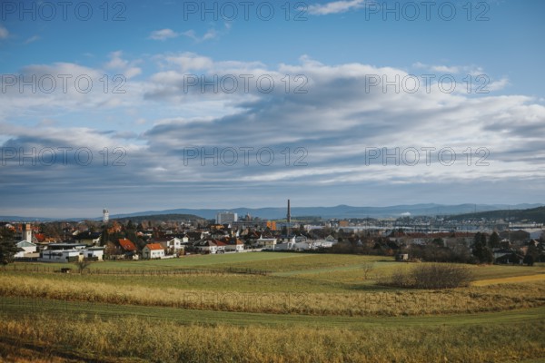 Panorama with city, fields and mountains under variable sky, Ternitz, Lower Austria, Austria
