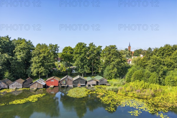Aerial view, drone photo: house lake with city church and colorful boathouses on stilts, Feldberg, Feldberg Lake District, Mecklenburg-Western Pomerania, Germany