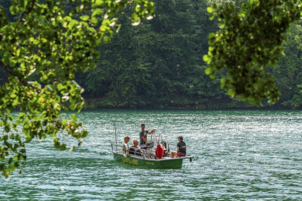 Manually operated ferry with ferryman and passengers, Lake Schmaler Luzin, Feldberg Lake District, Mecklenburg Lake District, Mecklenburg-Western Pomerania, Germany