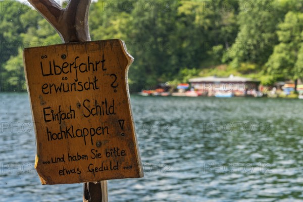 Crossing sign required, ferry station, canoe rental and cafÃ© am See Schmaler Luzin, Hullerbusch Nature Reserve, Feldberg, Feldberger Seenlandschaft, Mecklenburg Lake District in Mecklenburg-Western Pomerania, Germany