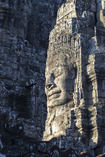 Huge stone-carved face of Bodhisattva Lokeshvara, also Avalokiteshvara, Bayon Temple, Angkor Thom, UNESCO World Heritage Site, Angkor Wat, Siem Reap, Cambodia