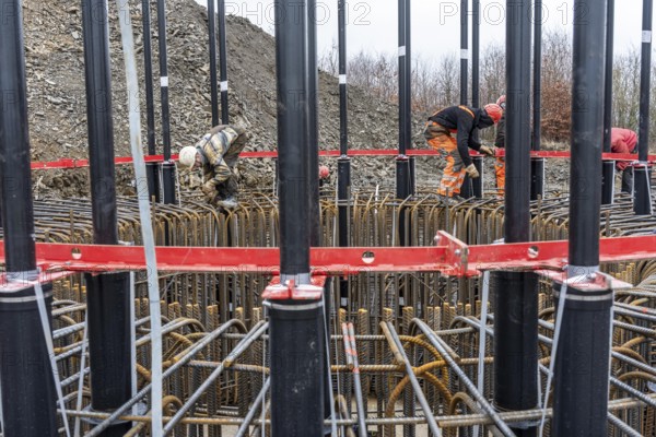 Assembly of reinforcing steel for the reinforced concrete foundation of a wind turbine, a mesh of rebar and rebar mesh, over 100 tons of reinforcing steel were used, the wind turbine will have a hub height of 160 meters, part of a new wind farm in Sauerland, near Balve, North Rhine-Westphalia, Germany