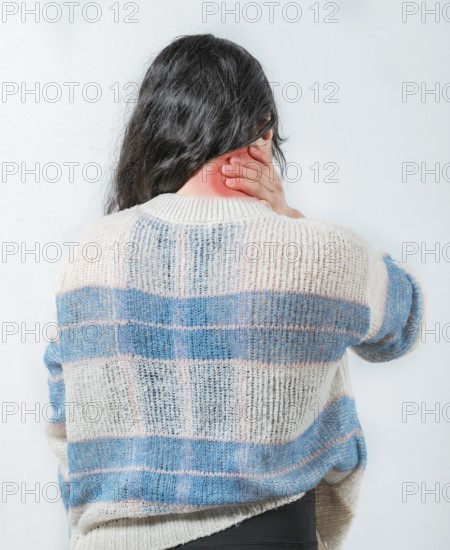 Suffering young woman with stress and neck pain. Close up female with neck pain. Woman in pain holding her neck
