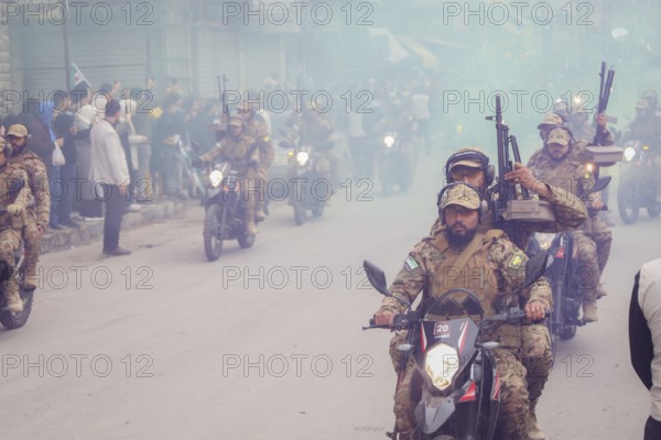 Aleppo, Syria â€“ December 08, 2025: The Syrian Army and Public Security forces hold a military parade marking the first anniversary of the Syrian revolution's victory and the fall of the Assad regime, attended by thousands of people, Aleppo, Aleppo, Syria