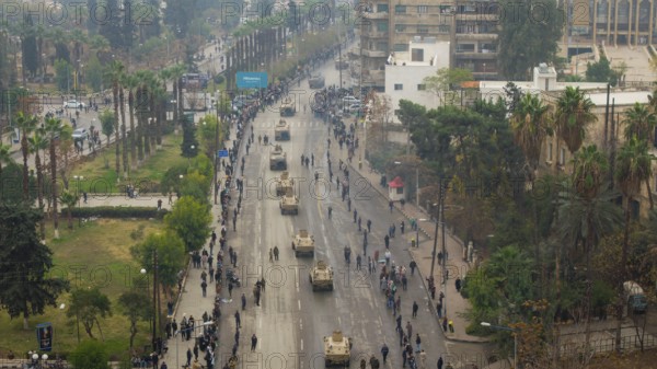 Aleppo, Syria â€“ December 08, 2025: Aerial shots capture the Syrian Army and Public Security forces conducting a military parade on the first anniversary of the Syrian revolution's victory and the fall of the Assad regime, attended by thousands of people, Aleppo, Aleppo, Syria