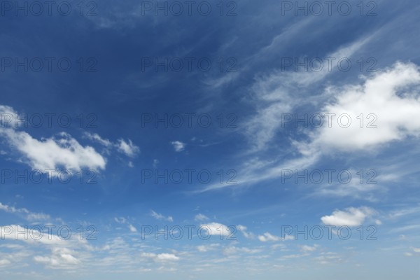 Clear Blue Sky with Whispy White Clouds - Perfect for Nature and Weather Backgrounds