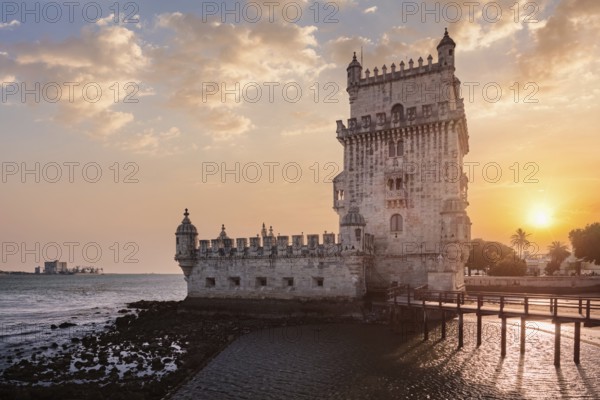 Belem Tower or Tower of St Vincent - famous tourist landmark of Lisboa and tourism attraction - on the bank of the Tagus River Tejo on sunset. Lisbon, Portugal