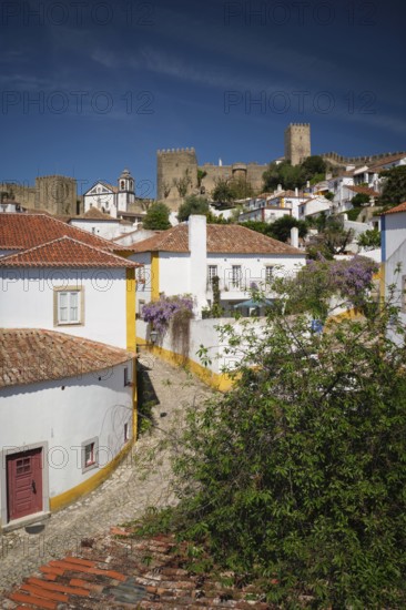 Charming town of Obidos with its medieval castle, ancient city walls, and picturesque rooftops. Portugal