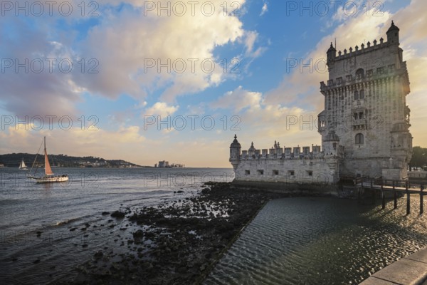 Belem Tower or Tower of St Vincent - famous tourist landmark of Lisboa and tourism attraction - on the bank of the Tagus River Tejo on sunset. Lisbon, Portugal