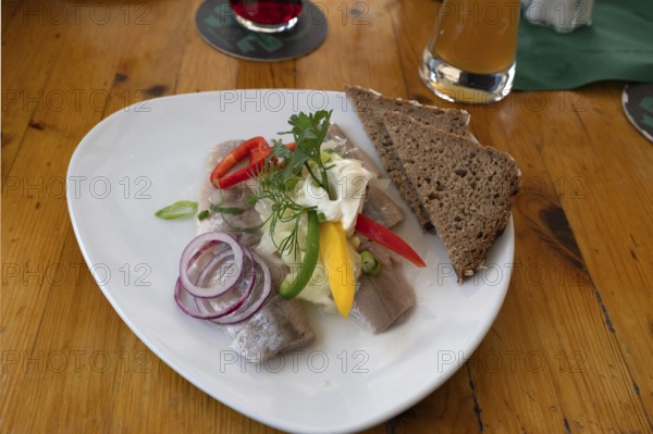 Fish platter with brown bread served in a harbour restaurant, Ahrenshoop, DarÃŸ, Mecklenburg-Western Pomerania, Germany