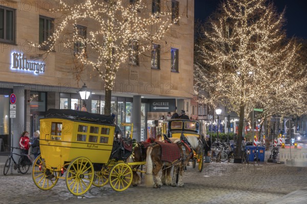 Historic stagecoach rides with horseback during the Nuremberg Christmas Market, Nuremberg, Middle Franconia, Bavaria, Germany