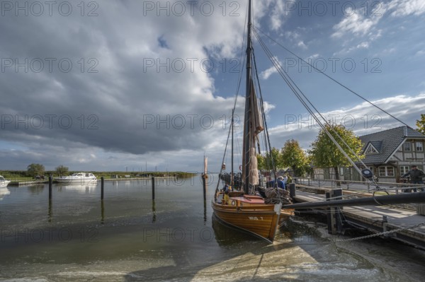 Historic sea boat, formerly used for sailing fishing, anchored in the port of Ahrenshoop, Mecklenburg-Western Pomerania, Germany