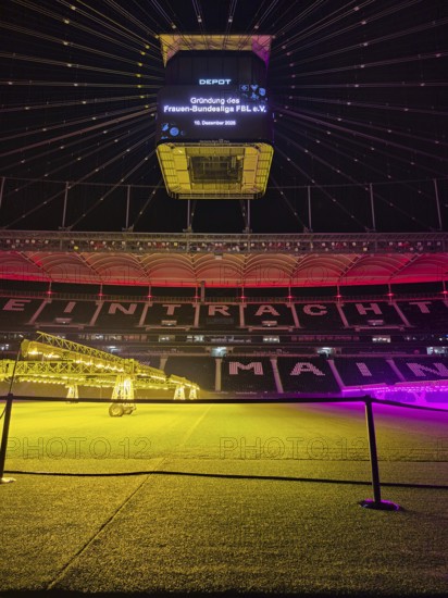 The Frankfurt Waldstadion (Deutsche Bank Park) is illuminated in red to mark the founding of the Women's Bundesliga Association and the video cube reads: Founding of the Women's Bundesliga FBL e.V. - 10 December 2025, Waldstadion, Frankfurt am Main, Hesse, Germany